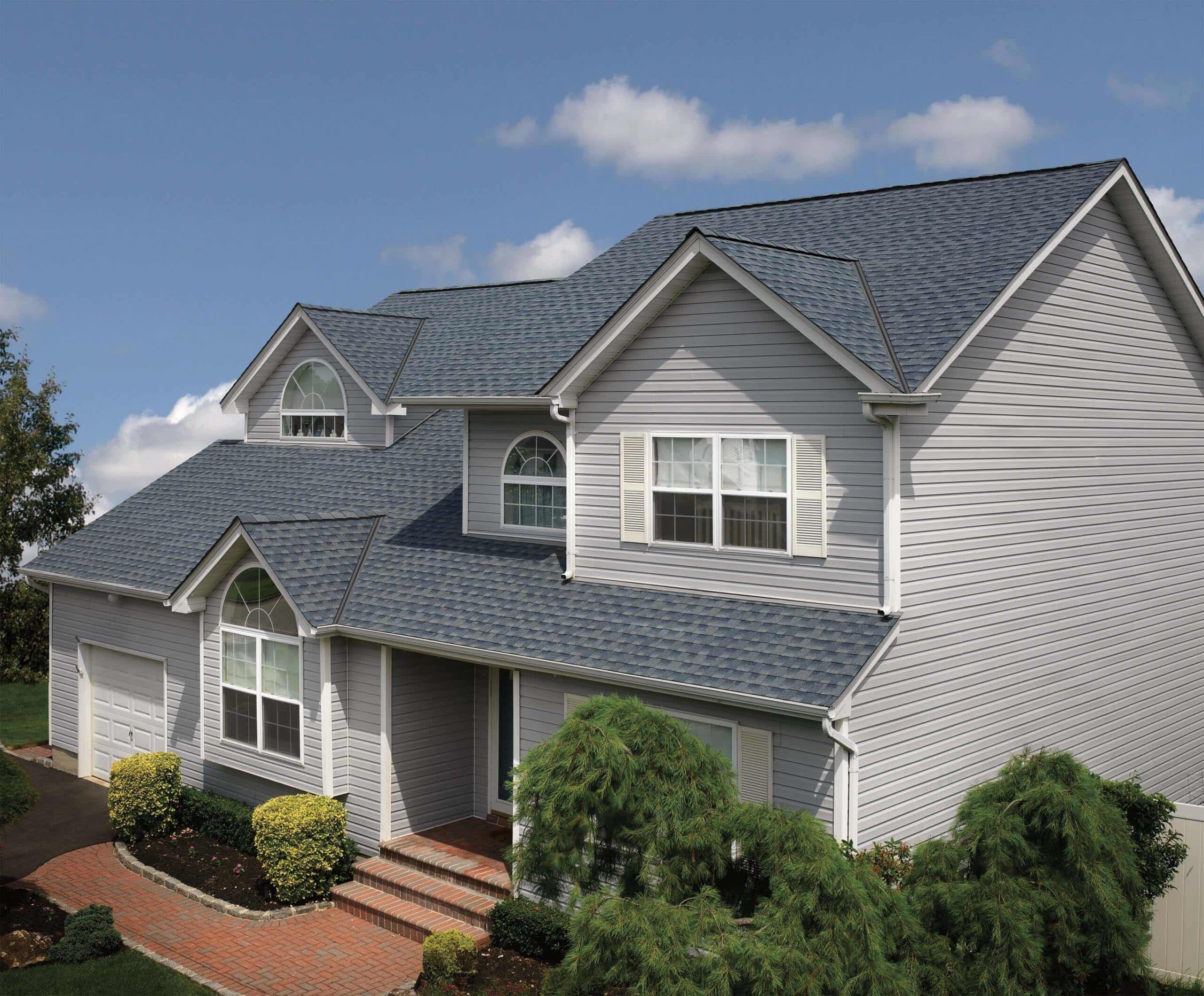 Completed roofing project on a gray home